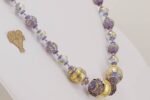 Lavender glass and Amethyst beaded necklace with 22 karat gold and sterling silver highlights.