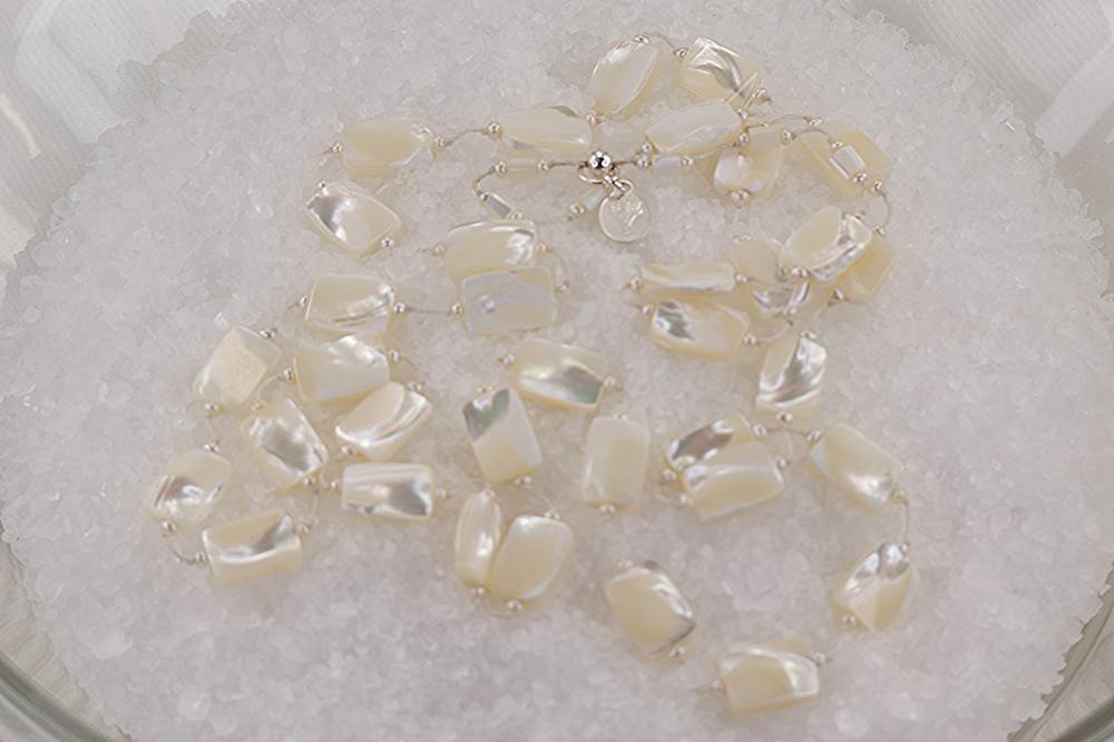 Handmade necklace with mother of pearl and mini freshwater pearls.