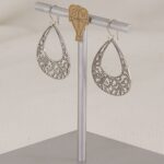 Handmade, scroll cut sterling silver earrings.