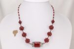 Unique red and sterling silver glass bead necklace.