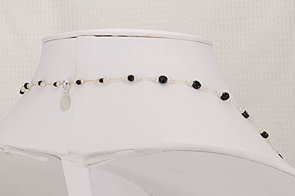 35 inch long necklace with faceted, black, spinel, moonstone and micro freshwater pearls.