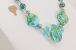 handmade blue green glass bead necklace with silver accents