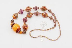 orange and purple colored glass bead necklace