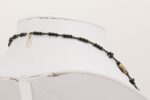 Black, brown and ivory colored glass bead necklace.