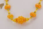 bright yellow and orange glass bead necklace.