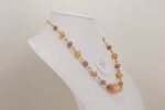 necklace made of rose quartz and blush opalescent glass beads