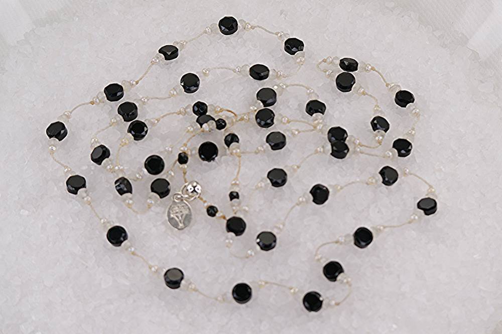 Necklace with faceted, semi precious, black spinel, moonstone and micro pearls