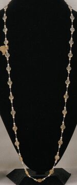 44 inch long, rutilated, quartz and pearl necklace.