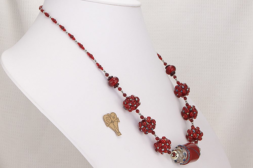 Stunning, one of a kind red glass bead necklace with sterling silver accents.
