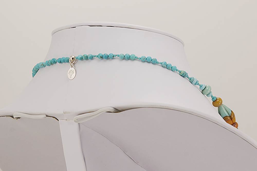 Necklace made of natural turquoise beads and terracotta and turquoise colored glass beads.