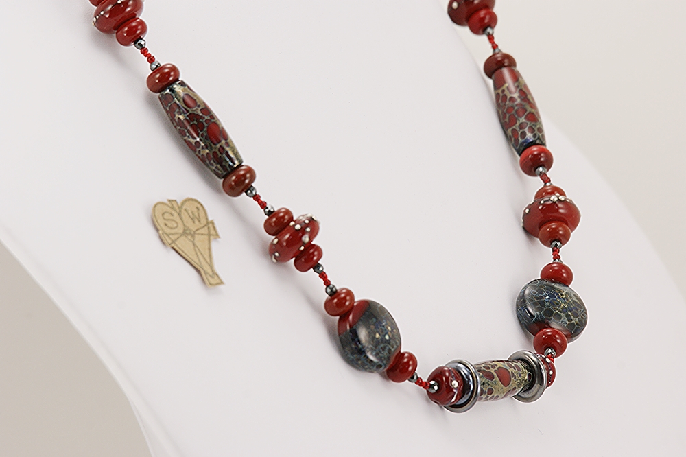 Red, black and grey colored glass bead necklace.