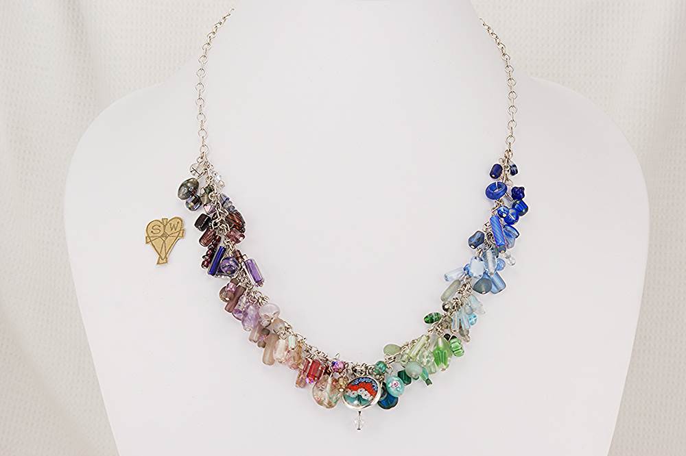 Beautiful necklace , handmade with a multi color collage of semi precious stone and glass beads on sterling silver chain.