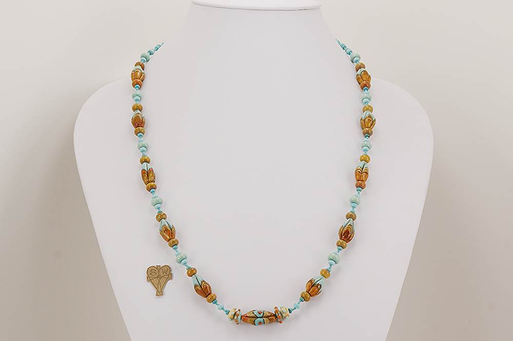 Handmade turquoise and terracotta glass bead necklace.