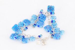Light and royal blue millefiori murano glass bead bracelet on sterling silver chain.