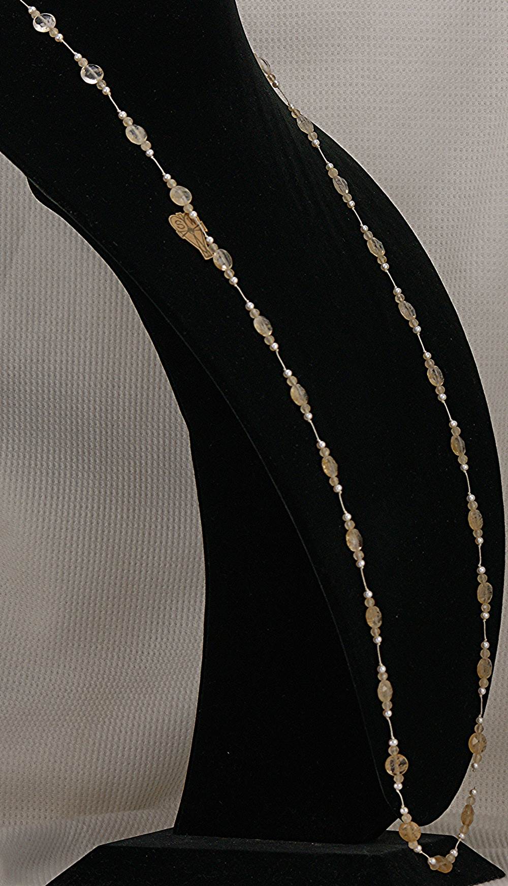 44 inch long, rutilated, quartz, camelian and fresh water pearl necklace.