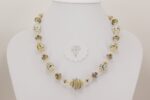 necklace with ivory colored sterling silver highlighted glass beads