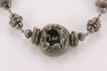 metallic grey glass beaded necklace with sterling silver accents and raku effects.