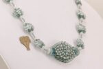Gray and white glass beaded necklace with moonstone beads.