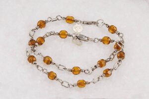 2 bracelet set made of copper colored glass beads with sterling silver.