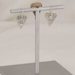 Handmade artistically imprinted sterling silver heart earrings.