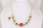One of a kind green red and gold glass bead necklace.