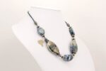 necklace blue black metallic glass beads with sterling silver flashing.