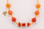 Bright orange, handmade, glass bead necklace.