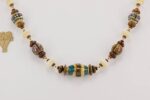 Chestnut and ivory color glass bead necklace.