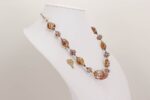 opalescent glass beaded necklace with sterling silver and rose gold accents.