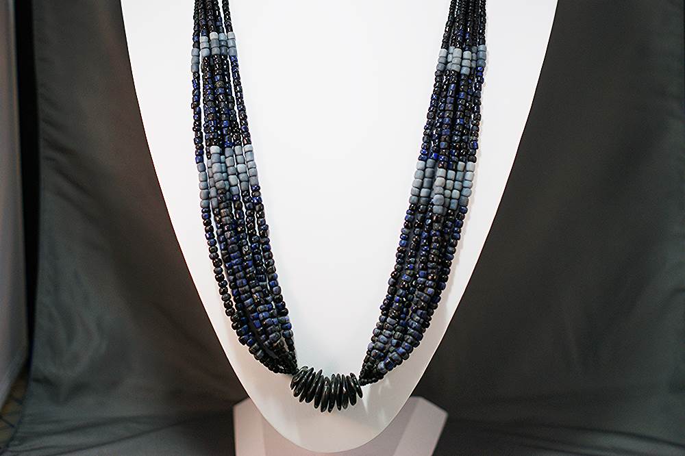 Black, blue and gray tribal bead necklace made of glass, horn and ceramic.