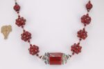 Red and silver one of a kind blown glass bead necklace.