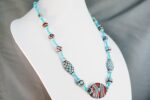 Handmade red and turquoise glass bead necklace.