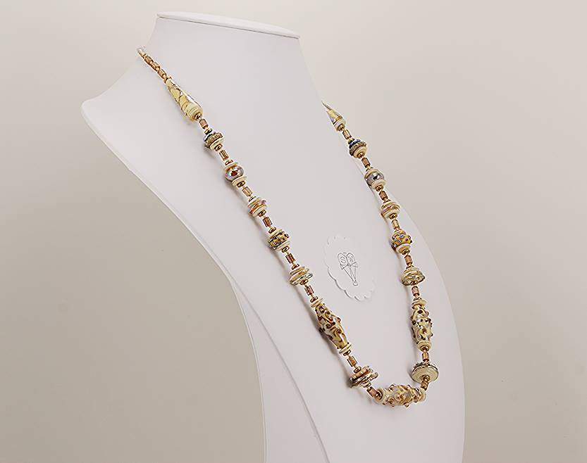 Ivory and sterling silver colored necklace with antique gold beads.