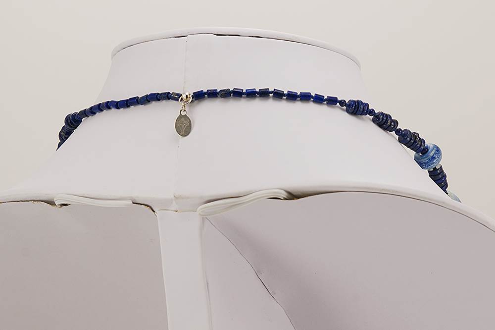 Cobalt and white glass beaded necklace with lapis lazuli stone.