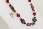 Red, black and grey colored glass bead necklace.
