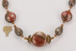 Rust red and bronze colored glass bead necklace.