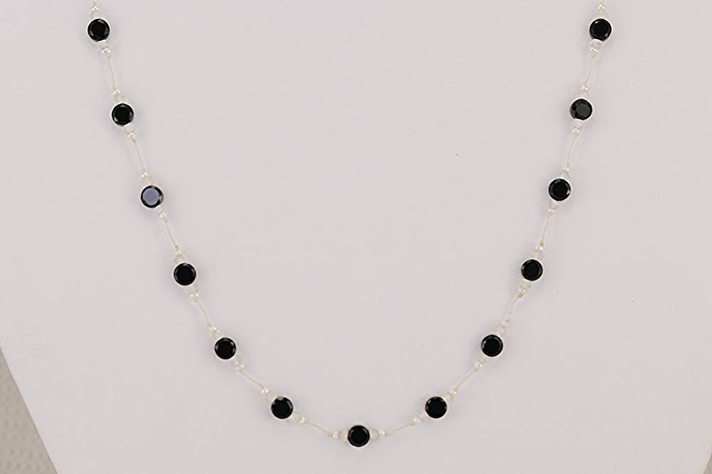 Moonstone and faceted black spinel beaded necklace with micro freshwater pearls.
