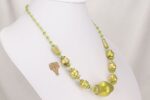 One of a kind green and gold blown glass bead statement necklace.