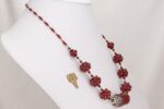 Stunning, one of a kind red glass bead necklace with sterling silver accents.