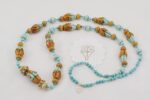 Turquoise beaded necklace with terracotta and turquoise colored glass beads.