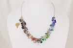 Beautiful necklace , handmade with a multi color collage of semi precious stone and glass beads on sterling silver chain.