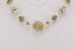 necklace made from ivory colored sterling silver highlighted glass beads