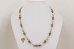 Handmade turquoise and terracotta glass bead necklace.