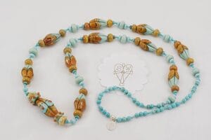Turquoise beaded necklace with terracotta and turquoise colored glass beads.