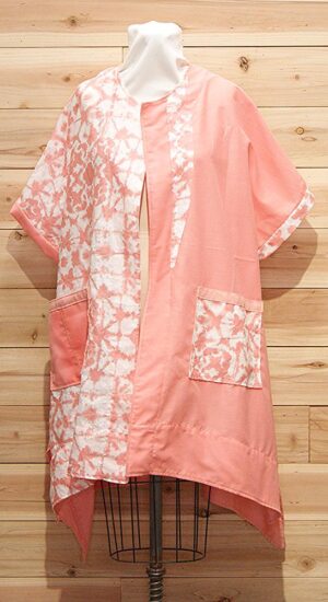 Chic cloak made of 100% Japanese salmon, peach and white shibori linen with 2 large front pockets.