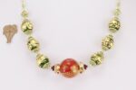 Unique red green and gold blown glass bead necklace with gold leaf finish.