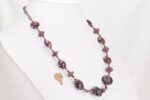 Raspberry and purple grape colored glass bead necklace.