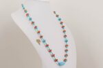 Turquoise red and orange glass bead necklace.