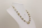 necklace made from ivory colored silver accented glass beads