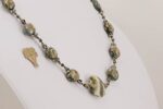 Grey and ivory colored necklace with sterling silver accents.